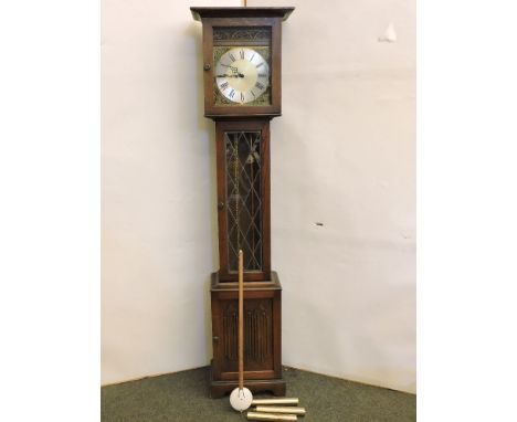 A modern oak longcase clock, by Old Charm, three brass weights and pendulum, Westminster chimes