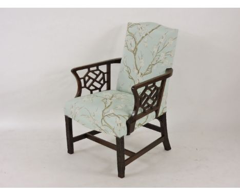 An 18th century Chippendale style armchair, with fretwork arm panels