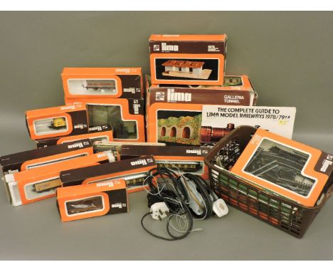 An Italian Lima part model railway, including a tank, loco, rolling stock and buildings, comes with boxes