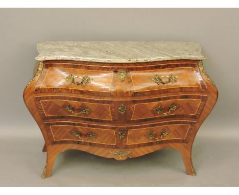 A reproduction French bombe form three drawer commode