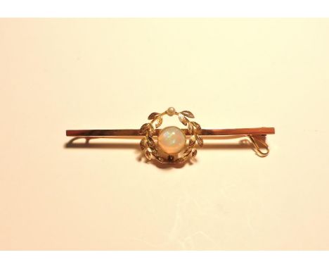 An Edwardian opal and seed pearl wreath bar brooch, marked 15ct