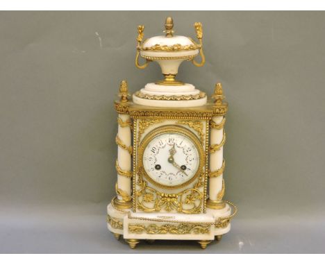 A late 19th century alabaster and gilt metal mantel clock, with eight day movement