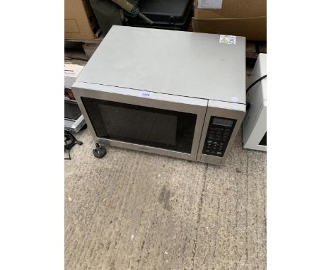 A SILVER KENWOOD MICROWAVE OVEN