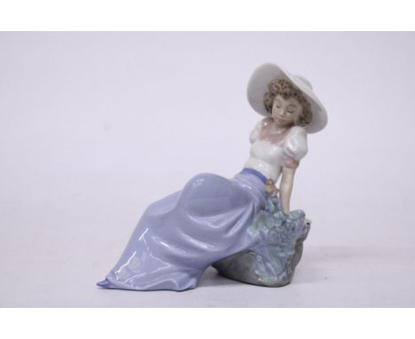 A NAO BY LLADRO FIGURINE OF A GIRL LISTENING TO THE BIRD SING