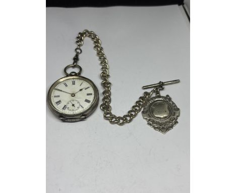 A MARKED 800 SILVER POCKET WATCH WITH WHITE ENAMEL FACE, ROMAN NUMERALS AND SUB DIAL WITH A HALLMARKED BIRMINGHAM SILVER FOB 