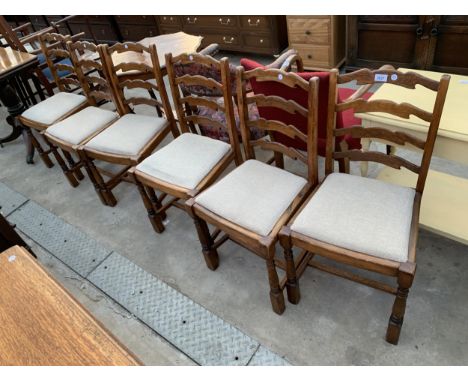 A SET OF SIX ELM AND BEECH LADDER BACK DINING CHAIRS