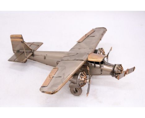 A TIN PLATE THREE ENGINE AEROPLANE