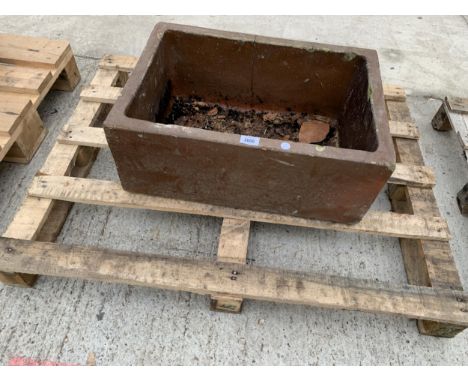 A BROWN SALT GLAZED TROUGH PLANTER