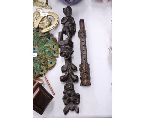 A WOODEN CARVED RECORDER STYLE MUSICAL INSTRUMENT PLUS A CARVED WOODEN WALL HANGING