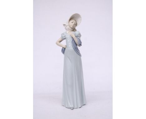 A NAO FIGURINE OF A LADY IN A BONNET AND SHAWL