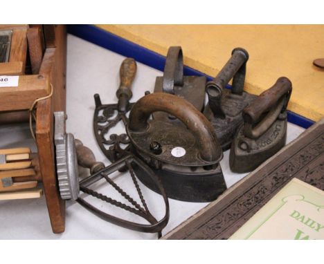 FOUR VINTAGE CAST IRONS TO INCLUDE A CHARCOAL IRON, LACE IRON, ETC PLUS TWO IRON TRIVETS