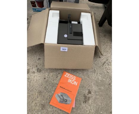 A BOXED ZEISS IKO SLIDE PROJECTOR