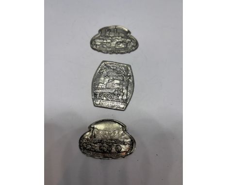 THREE WHITE METAL WALKING STICK BADGES