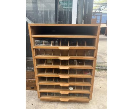 A TEAK WATCHMAKERS HABERDASHERY CABINET CONTAINING A LARGE SSORTMENT OF WATCH MAKING TOOLS AND SPARES TO INCLUDE FILES, WATCH