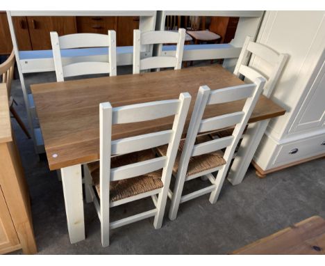 AN OAK DINING TABLE ON PAINTED BASE, 60" X 30" AND FIVE RUSH SEATED LADDER BACK DINING CHAIRS