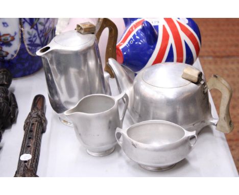 A VINTAGE PICQUOT WARE TEASET TO INCLUDE A TEAPOT, HOT WATER POT, CREAM JUG AND SUGAR BOWL