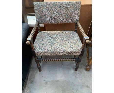 AN EARLY 20TH CENTURY BOBBIN TURNED ARM CHAIR