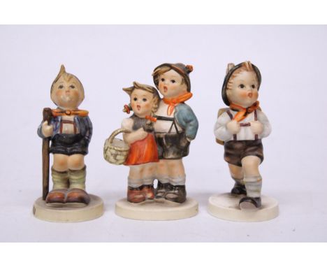 THREE GOEBEL HUMMEL FIGURES "SURPRISE" NO. 943/2 "LITTLE HIKER" NO. 16 2/0 AND "SCHOOL BOY" NO. 82 2/0