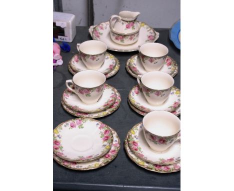 A ROYAL DOULTON VINTAGE 'ENGLISH ROSE PART TEASET TO INCLUDE A CAKE PLATE, SUGAR BOWL, CREAM JUG, CUPS, SAUCERS AND SIDE PLAT