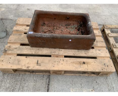 A BROWN SALT GLAZED TROUGH PLANTER