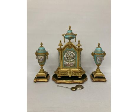 A FRENCH J. MAYER ORMOLU PORCELAIN AND GILT METAL MANTEL CLOCK WITH URN STYLE GARNITURE IN THE LOUIS XVI STYLE WITH A PORCELA