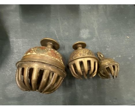 A VINTAGE TRIO OF BRASS CLAW BELLS