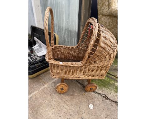 A SMALL VINTAGE WICKER DOLLS PRAM