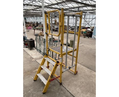 A LARGE DECORATORS TOWER WITH THREE RUNG STEP