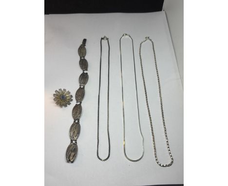 THREE SILVER NECKLACES , A POSSIBLY SIILVER BRACELET AND A POSSIBLY SILVER BROOCH