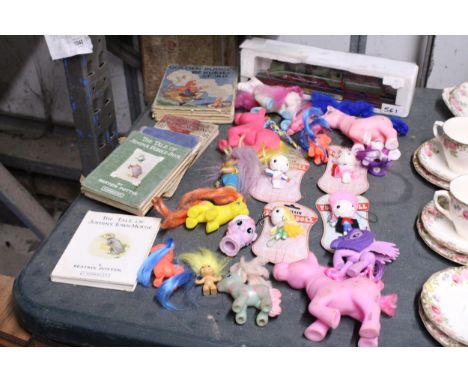 A QUANTITY OF TOYS TO INCLUDE A COLLECTION OF MY LITTLE PONY, MODEL OF A TRAIN, VOODOO DOLL KEY CHAINS AND BOOKS