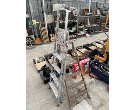 A FOUR RUNG ALUMINIUM STEP LADDER AND A FURTHER THREE RUNG VINTAGE WOODEN STEP LADDER