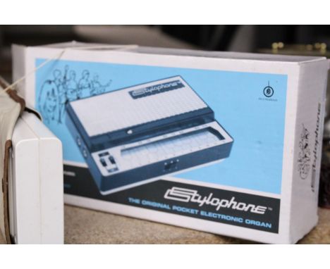 A BOXED STYLOPHONE AND A CASIO ELECTRONIC MUSICAL INSTRUMENT