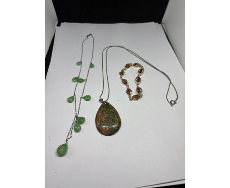 TWO SILVER NECKLACES WITH STONES AND A FLOWER DESIGN SILVER BRACELET
