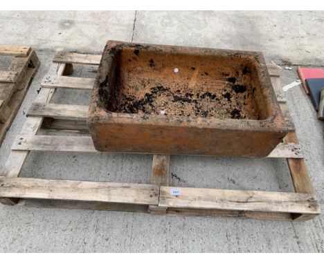 A BROWN SALT GLAZED TROUGH PLANTER