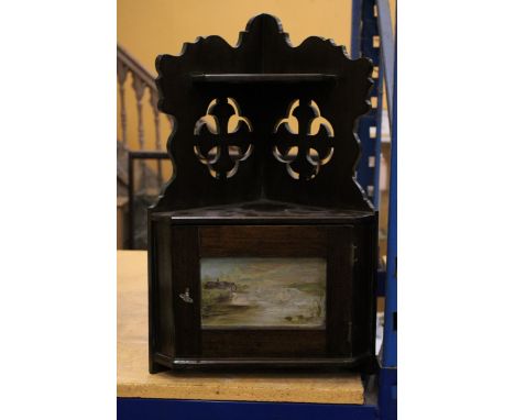 A VINTAGE MAHOGANY WALL CORNER CUPBOARD WITH PIERCED DECORATION AND HANDPAINTED SWAN DESIGN TO THE DOOR - WITH KEY