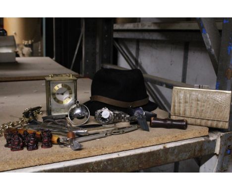 A MIXED LOT TO INCLUDE A CARRIAGE CLOCK, WATCHES, NUT CRACKERS, A TRILBY HAT, ETC