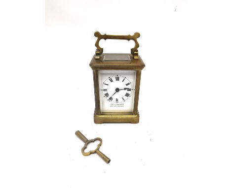 A late 19th century brass leather cased travelling carriage clock with skeleton movement and key. Inscribed  'C Guillemin &am