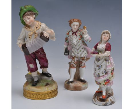 German porcelain figure of a waif playing an accordion, 15cm and five other small German figurines (6).