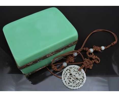 String of nephrite beads, jadeite pendant pierced and engraved, green coloured casket with gilt metal and enamel decoration, 