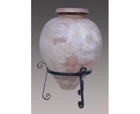 Terracotta Ali Baba urn, on a scrolled wrought iron tripod stand, 122cm overall.