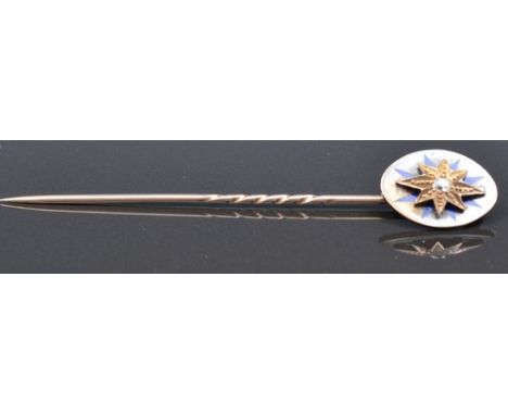 Yellow metal and enamel pin, with a single diamond within a star setting, 8cm, in original box, labelled Dyer Goldsmith &  Wa