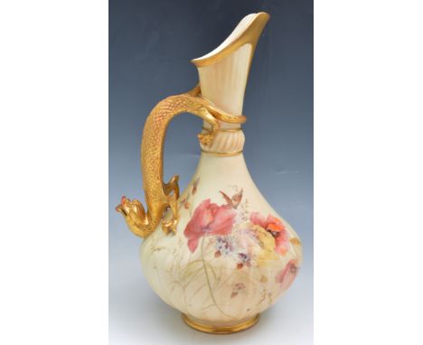 Large Royal Worcester ewer shaped vase, circa 1900, decorated with poppies and butterflies on a blush ground, serpent handle,