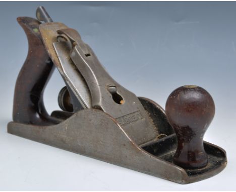 Collection of chisels, box planes and other carpentry tools.