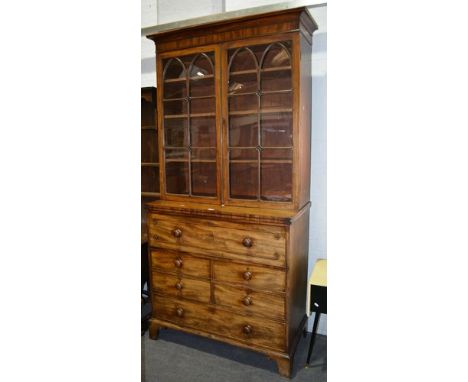 A George III mahogany bookcase secretaire, cavetto moulded cornice, plain frieze, two lancet-shaped astragal glazed doors to 