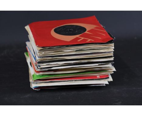 **Collection of Vintage 7-Inch Vinyl Records with Sleeves - 50+**This collection of 7-inch vinyl singles features a diverse a