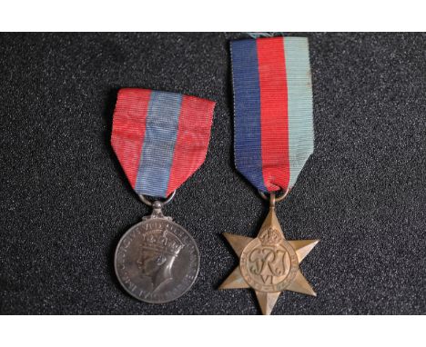 World War II British Military Medal GroupThis collection features two World War II British campaign medals:1. **War Medal 193