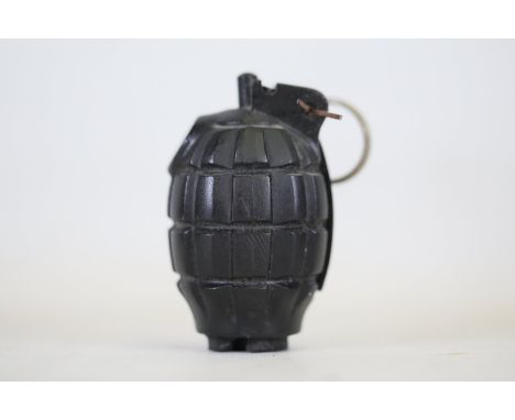 Replica Hand Grenade with Classic "Pineapple" DesignThis item is a detailed replica of a classic fragmentation grenade, commo