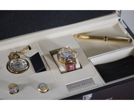 **Earnshaw Branded Luxury Collection**This is a sophisticated collection of luxury items presented in a polished dark wood di