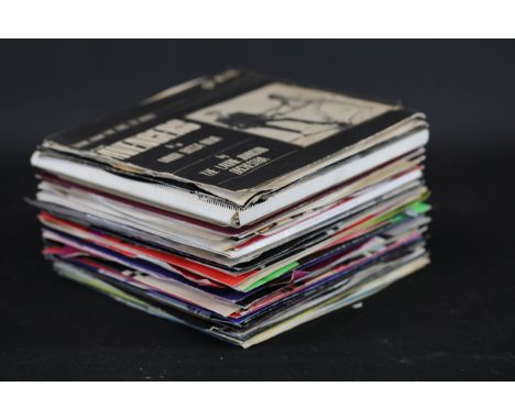 **Collection of Vintage 7-Inch Vinyl Singles Featuring Punk, Reggae, and Rock Artists**A diverse collection of 7-inch vinyl s
