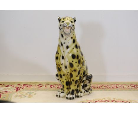 Ceramic Seated Leopard Ornament  A finely crafted ceramic leopard ornament depicting a seated leopard with an open mouth, det